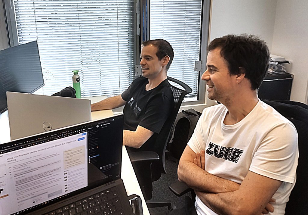 Maxim and Ruben working at Zure Belgium office.