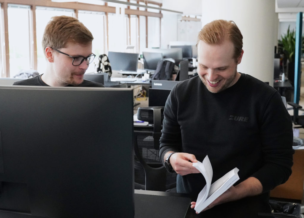 Data Architects Samu and Markus working together at Zure's Helsinki office.